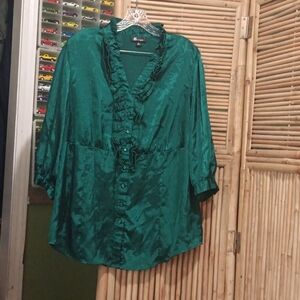 Very pretty green blouse with ruffles and buttons in the front